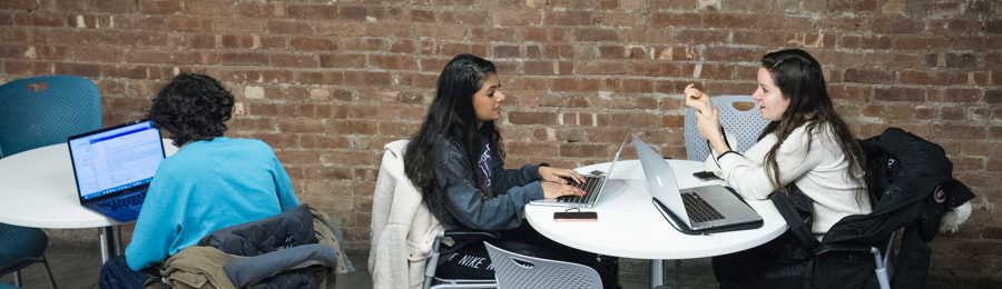 Students studying at tables