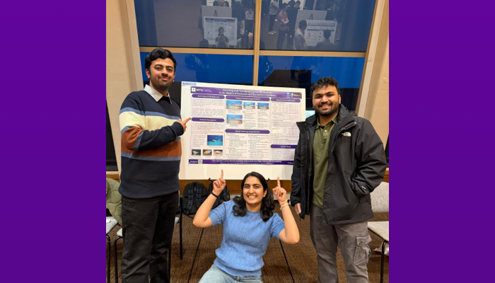 Capstone team of three with their project poster