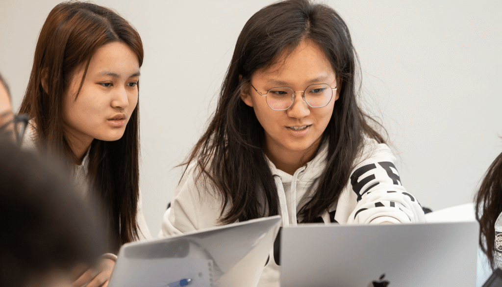 Students looking at computers